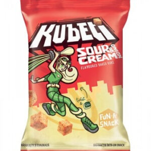 The image shows a bag of Kubeti snacks, specifically the Sour Cream flavored variety. The packaging is vibrant with a red and cream color scheme. The design features a dynamic cartoon character in green, striking an action pose. The character is depicted with long blonde hair and cartoonish proportions. There are illustrated cubes, likely representing the snack pieces, scattered on the packaging. The words Flavoured Baked KUBS and FUN-A-SNACK appear prominently.