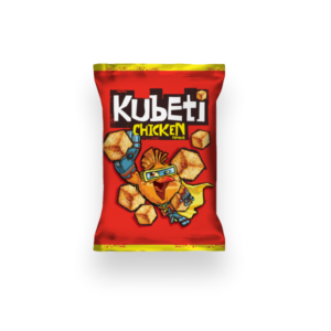 The image is of a snack package for Kubeti with a chicken flavor. The packet is predominantly red with a yellow top and bottom border. The brand name Kubeti is prominently displayed at the top in bold, stylized white letters, with Chicken Flavour in yellow below it. The design features an illustrated character of a chicken wearing superhero attire and goggles. Scattered around the character are several cube-shaped snacks.