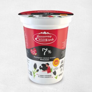 The image shows a container of Bulgarian yogurt with a red and black label. The brand name is in white text with a mountain logo above it. The label indicates 7% fat content in large white numbers. Below, there's an illustration of a person milking a buffalo. The container is 400g and features other design elements like tulips and certification logos. The text on the container is primarily in Bulgarian.