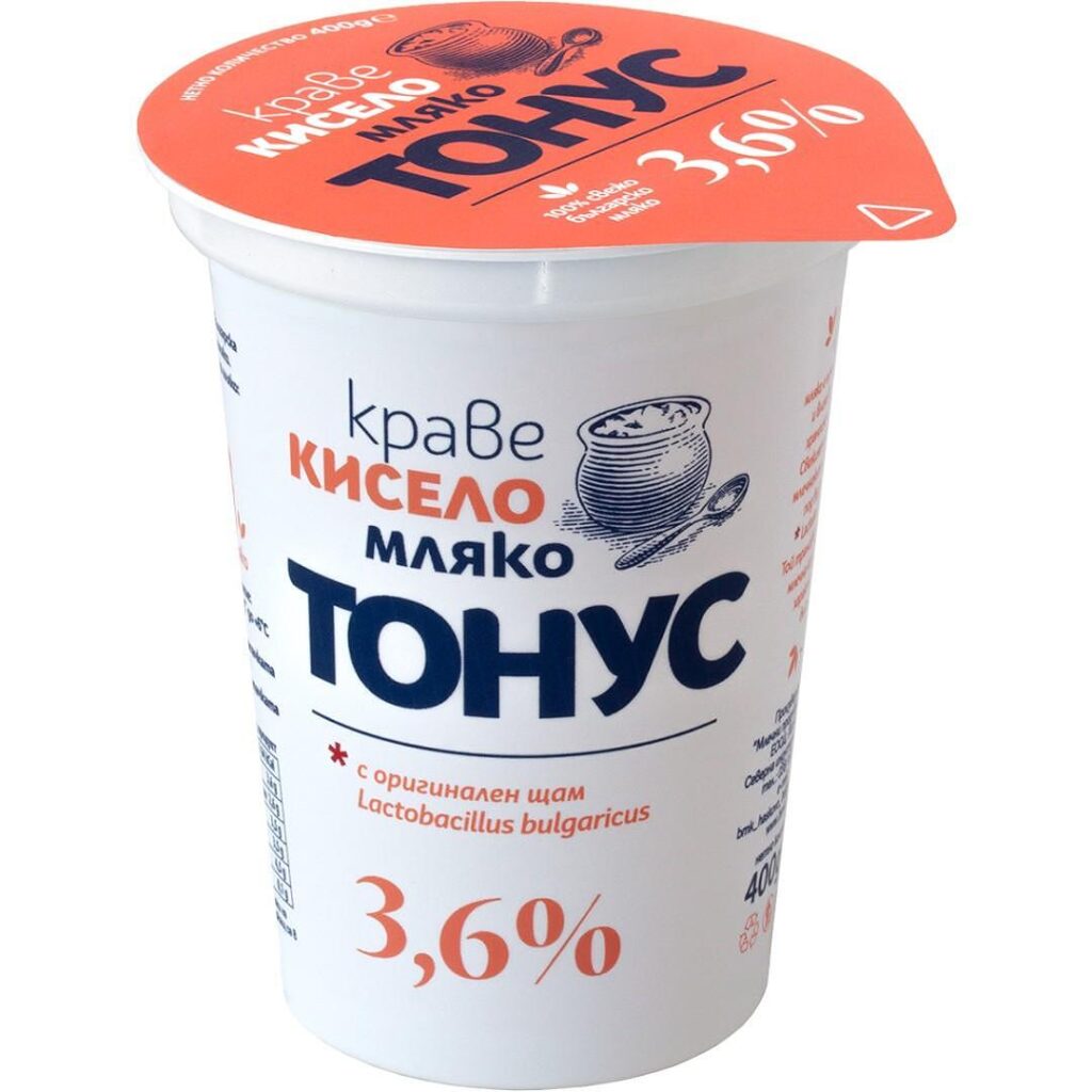 The image shows a yogurt container with a red lid and white body. The lid features text in Bulgarian and shows a percentage, 3.6%, prominently. The body also has text in Bulgarian, including the word ТОНУС in bold, dark blue, along with an illustration of a bowl with a spoon. It mentions Lactobacillus bulgaricus and indicates the yogurt has a fat content of 3.6%.