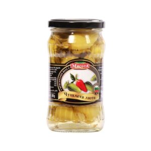 The image shows a glass jar with a black lid containing pickled yellow peppers. The label on the jar features illustrations of peppers, including a red and green one, and has text in Bulgarian. The brand name appears at the top of the label, and there are logos indicating certification or origin. The contents are preserved in brine, visible through the clear glass jar.