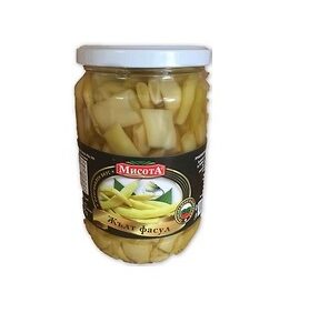 The image shows a glass jar with a white lid containing yellow beans. The label on the jar features an image of yellow beans and includes text in a Slavic language. The design is predominantly black with accents that highlight the brand name and product information. The beans are packed in a liquid inside the jar.