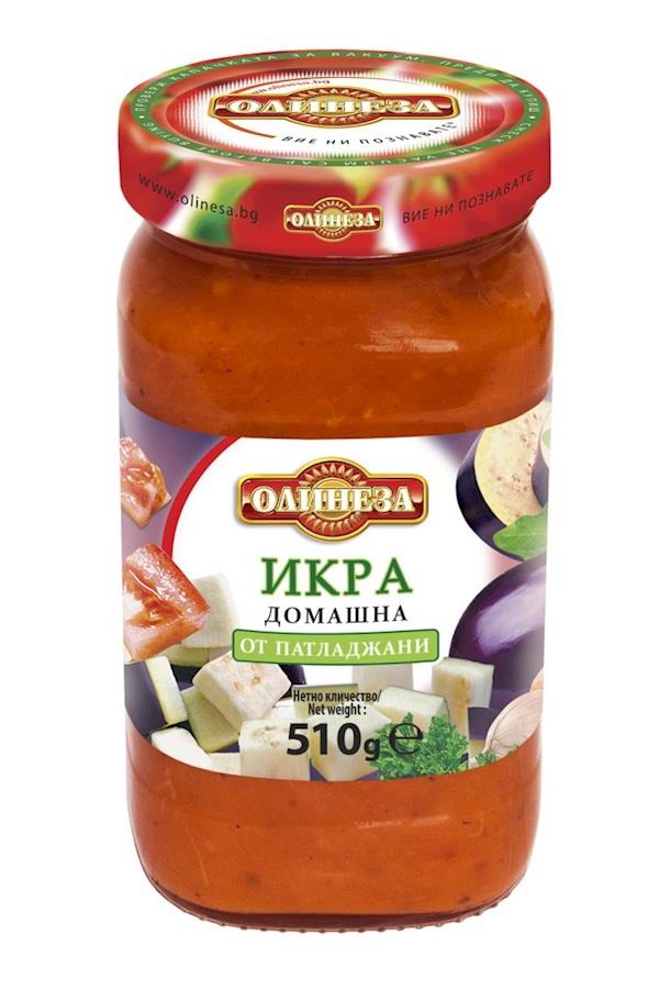 This is a jar of Olineza brand eggplant caviar. The label is predominantly white with the brand logo prominently displayed. It features images of vegetables like eggplants and red peppers. The text is in Bulgarian, indicating it's a homemade product made from eggplants, with a net weight of 510 grams. The lid is red with the brand logo and website information.