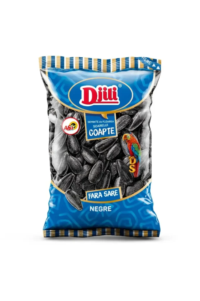 The image shows a package of roasted sunflower seeds. The packaging is mainly blue with striped accents at the top. It features the Dillii logo prominently at the top. There are Romanian words on the package, including Seminte de floarea-soarelui coapte and Fara Sare, which translate to Roasted sunflower seeds and No salt, respectively. There's an image of a parrot on the front, and the package contains black sunflower seeds.