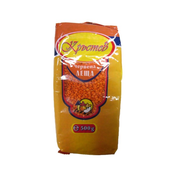 The image shows a package of red lentils. The label features red, yellow, and blue colors with Cyrillic text. The front of the package has a clear section displaying the lentils inside. The bottom text indicates a weight of 500 grams. There are small icons depicting food preparation on the package.