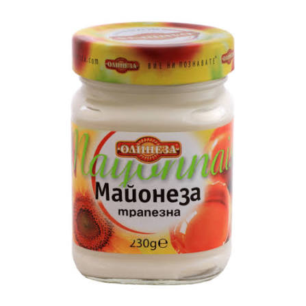 The image shows a glass jar of mayonnaise with a colorful label. The label features the brand name and product description in Cyrillic script. There are images of eggs and sunflower heads on the label, hinting at the ingredients. The lid is red and yellow with branding. The product weight is indicated as 230 grams.