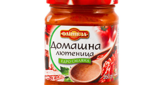 The image shows a jar of Лютеница, a traditional Bulgarian condiment. The jar has a red lid and contains a red, paste-like substance. The label features text in Cyrillic and an image of tomatoes and peppers. The weight is indicated as 260g. There is also an illustration of a wooden spoon filled with the condiment. The brand name is positioned prominently at the top of the label.