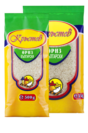 The image shows two packages of Bulgarian rice from a brand named Кръстев. The packaging features a bright design with green and yellow as the primary colors. Each package has a cartoon chef logo at the bottom center. The smaller package is labeled 500 g, while the larger one is labeled 1 kg. The text is in Cyrillic script.