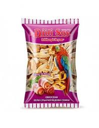 The image is of a package labeled Dilli Soy with a purple and white design. It prominently features an illustration of a colorful parrot perched on what appears to be pasta or snack pieces. The text and imagery suggest it may be a food product, possibly with a flavor or theme related to soy or parrot food. There is additional text in another language, likely descriptive or brand information.